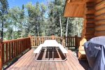 Deer Haven Lodge deck with picnic area and gas grill. 